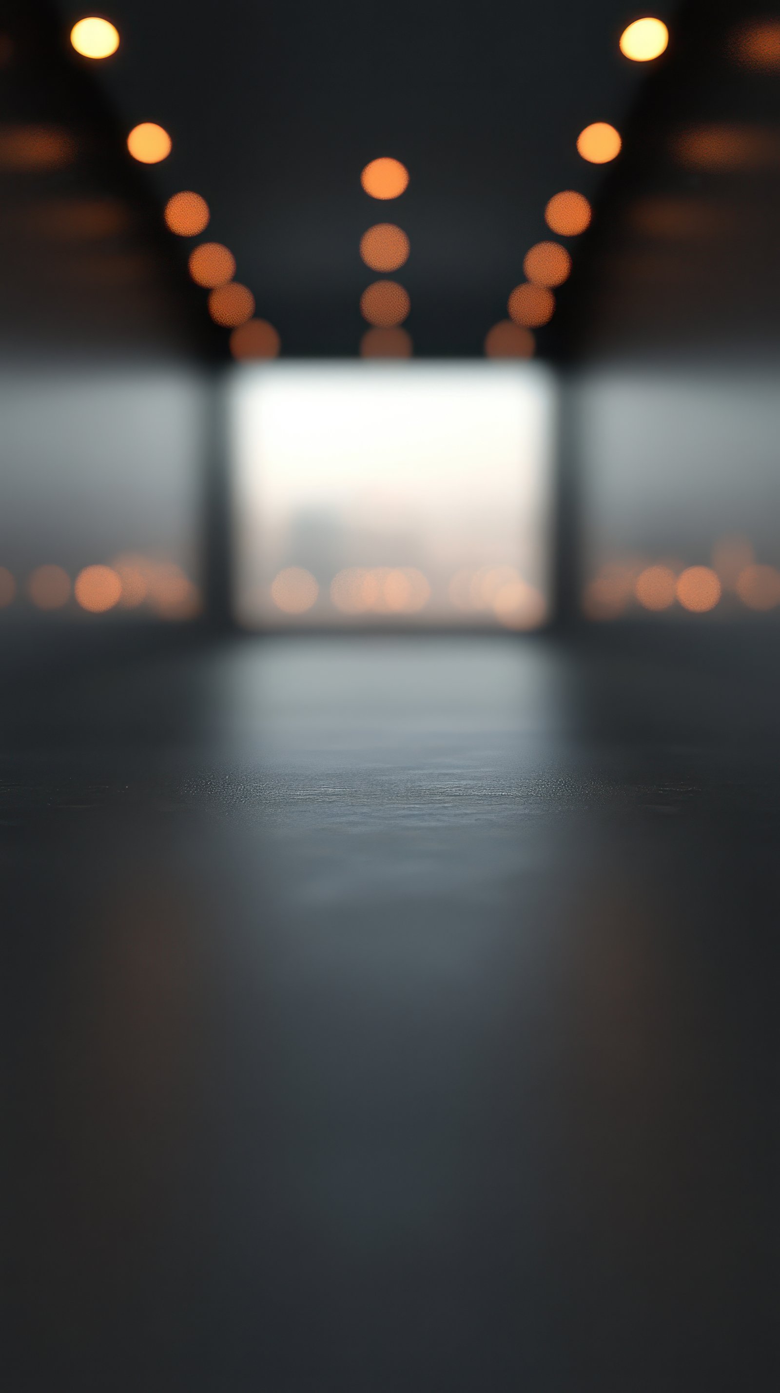 Softly glowing lights illuminate an empty modern space, highlighting its sleek lines and tranquil atmosphere during early evening hours